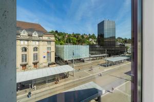 a view of a city street with a building at Tailormade Hotel METROPOL St Gallen in St. Gallen