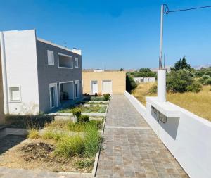 a house with a walkway in front of it at Gennadi Escape House in Gennadi