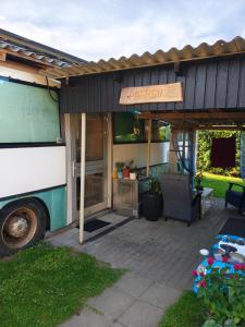 a bus parked in front of a food truck at Glampingbus in Kärdla