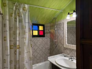 a bathroom with a sink and a shower curtain at BLEU MAISON-PAZO 1 CL in Campo Lameiro +29 photos
