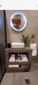 a bathroom with a sink and a mirror at Villa Mareta in Svoronata