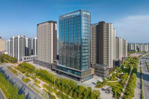 an aerial view of a city with tall buildings at Fairfield by Marriott Yulin in Yulin