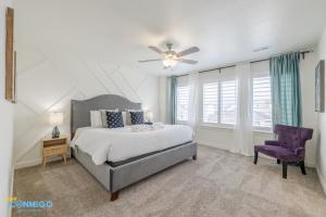 a bedroom with a bed and a ceiling fan at Pooley Pad in American Fork