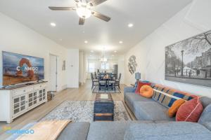 a living room with a couch and a table at Pooley Pad in American Fork