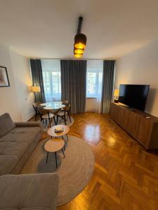 a living room with a couch and a table at Apartament Witosa in Tarnów