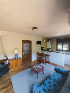 a living room with a couch and a table at ARES Ecoresort in Camarasa +47 photos