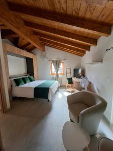 a large bedroom with a bed and a chair at Mondo D'Oro in Macugnaga +58 photos