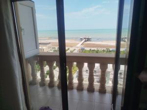 a view of a balcony with a view of the beach at sumqayit bulvari deniz kenari in Sumqayıt +4 photos