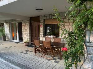 a table and chairs sitting on a patio at Apartma Loško in Cerknica