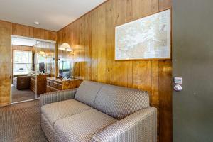 a living room with a couch and a map on the wall at King Birch Lake Home, Unit 3 in Alton