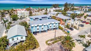 an aerial view of a city with houses and the ocean at Coastal Cheer in Bradenton Beach