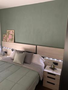 a bedroom with a large bed with a headboard at El Relax, La Puebla De Castro in La Puebla de Castro +18 photos