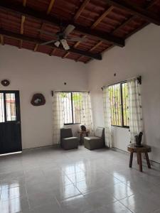 a large living room with couches and windows at Casa ciruelo in Las Varas