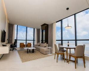 a living room with a table and a couch at Atlantic Suites Hotel in Georgetown