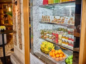 a refrigerator filled with lots of fruits and vegetables at Atlantic Suites Hotel in Georgetown