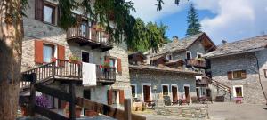 a group of buildings with balconies on them at La gerbe d'or in Saint Nicolas