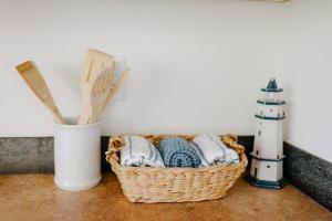 a basket of towels and a lighthouse on a counter at The Lighthouse in Moscow +43 photos