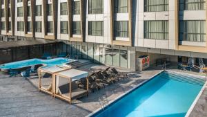 an overhead view of a building with a pool and chairs at Residence Inn by Marriott Bromont in Bromont