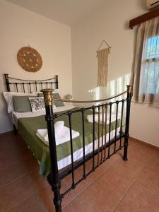 a bedroom with two beds in a room at Almyra Seaside Apartments in Elia Laconias