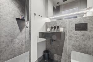 a bathroom with a sink and a shower at The Maida Hotel in London