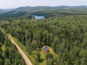 an aerial view of a house in the middle of a forest at Chalet Chic et Spa - St-Come in Saint Come