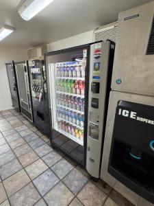 two vending machines in a store with drinks in them at Travel Inn in Greensboro
