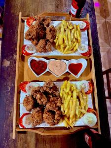 a tray of food with french fries and meatballs at The Mountainstream Lodge in Lethem +9 photos