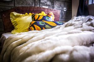 Postel nebo postele na pokoji v ubytování Runda Lofts