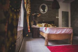 Postel nebo postele na pokoji v ubytování Runda Lofts