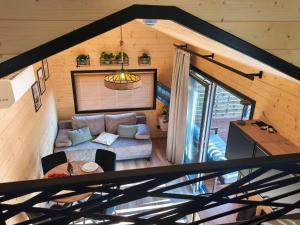 an overhead view of a living room with a couch at Tiny Vinkel - Domki Tiny House Jastarnia in Jastarnia