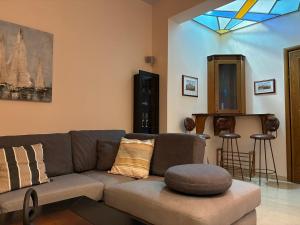 a living room with a couch and a table at Dream Home Thiva in Thiva