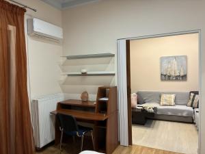 a room with a desk and a couch at Dream Home Thiva in Thiva +7 photos