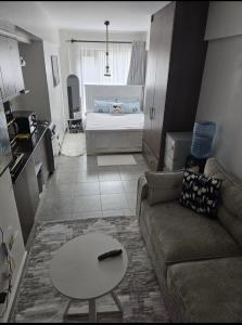a living room with a couch and a table at Luna Homes at Tsavo Sunset, Kiambu Road in Kiambu