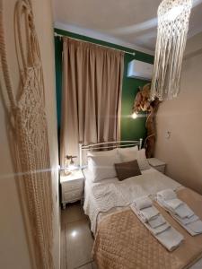 a bedroom with a bed and a green wall at The Mastiha Spot 1 in Chios