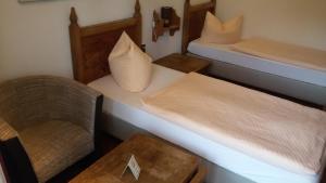 Postel nebo postele na pokoji v ubytování Solitaire Hotel