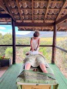 a woman sitting on the back of an elephant at Sitio Tashi Delek in Cavalcante