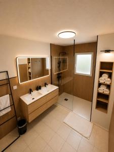 a bathroom with a sink and a shower at Maison Mirepoix 100m2 in Mirepoix +30 photos