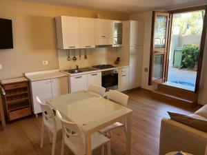 a kitchen with a table and chairs in a room at Casa Scrivani in Pineto