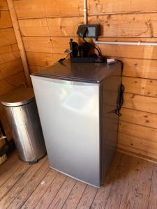 a camera on top of a refrigerator in a room at la bulle d'Astrée in Le Tronchet