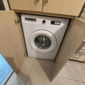 a washer and dryer in a box in a room at The Mastiha Spot 1 in Chios