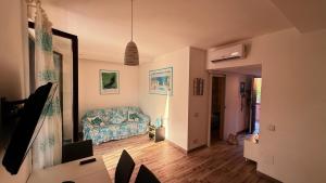 a living room with a couch in a room at argentario home in Porto Santo Stefano