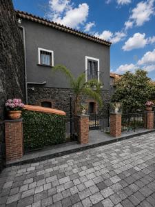 a house with a fence in front of it at Il Casale del 900 in Catania +38 photos