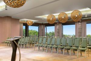 a row of chairs in a room with windows at Le Domaine Deva, Series by Marriott in Bourail +111 photos