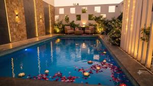 a pool with a bunch of balls in the water at Hotel Coral Shade's in Mahabalipuram