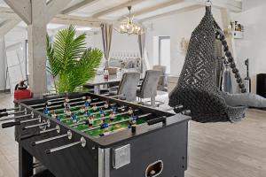 a table with a chess board in a living room at Golden Grey Loft Bahrenfeld Volkspark Hamburg in Hamburg