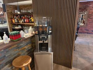 a coffee maker sitting on top of a counter at Hotel am Schloss - Frankfurt an der Oder in Frankfurt Oder