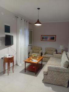 a living room with a couch and a table at Villa Harmony in Xanthi