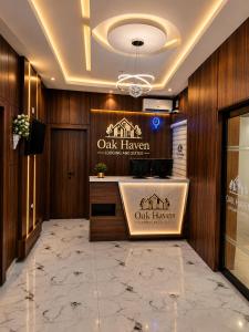 a lobby of a oak haven with a sign on the wall at Oak Haven Lodging & Suites in Sagamu