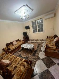 a living room with two beds and a couch at Salamandre in La Salamandre