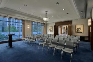 a room with rows of chairs and a podium in it at The Westin Melbourne in Melbourne +79 photos